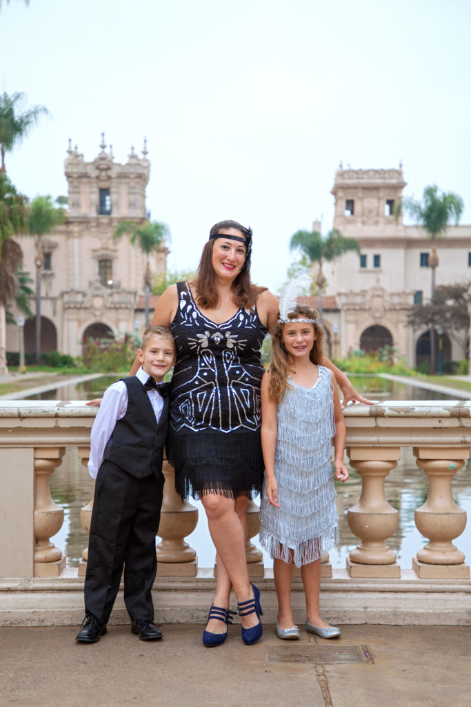 Mother and children standing on a bridge in Balboa Park