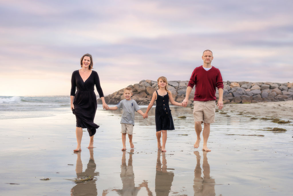 Family walking along South Ponto Beach in Carlsbad