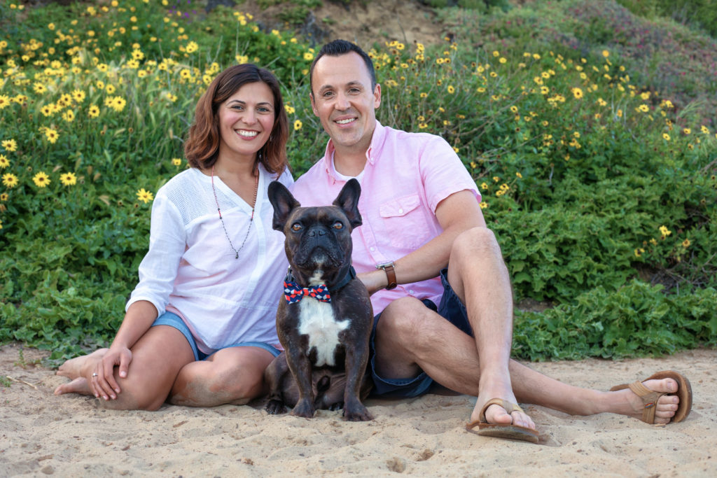 Beach family photo shoot with dog wearing a bowtie.