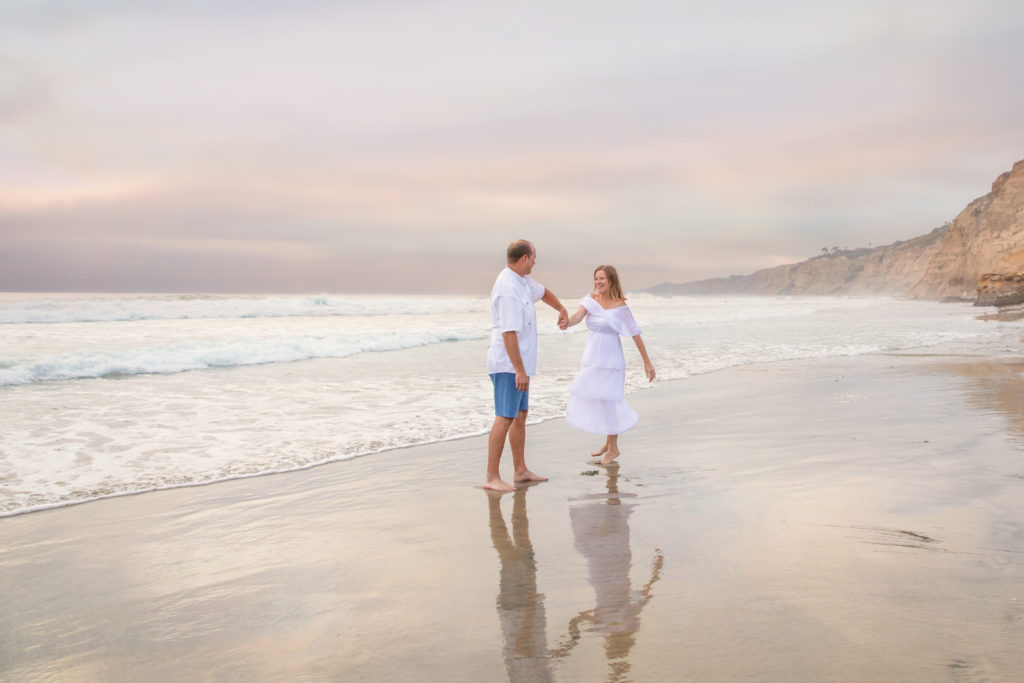 Couple dancing on the beach in La Jolla.
