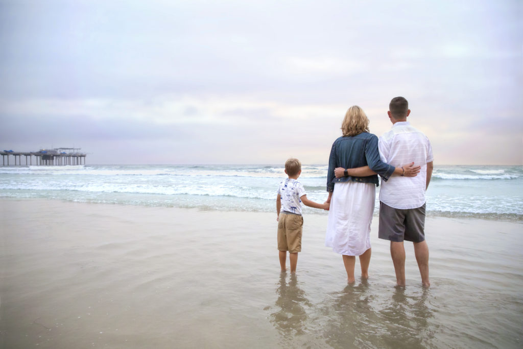 Family watching the sunset at Scripps Pier