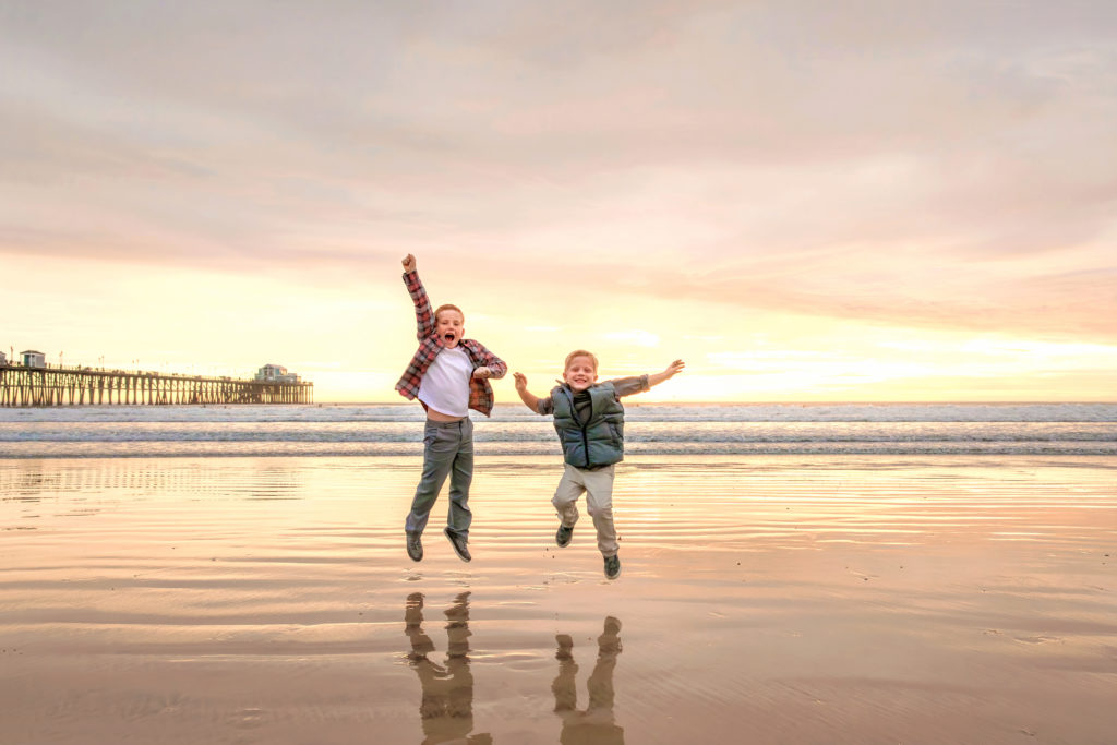 Boys playing on Oceanside Beach Pier